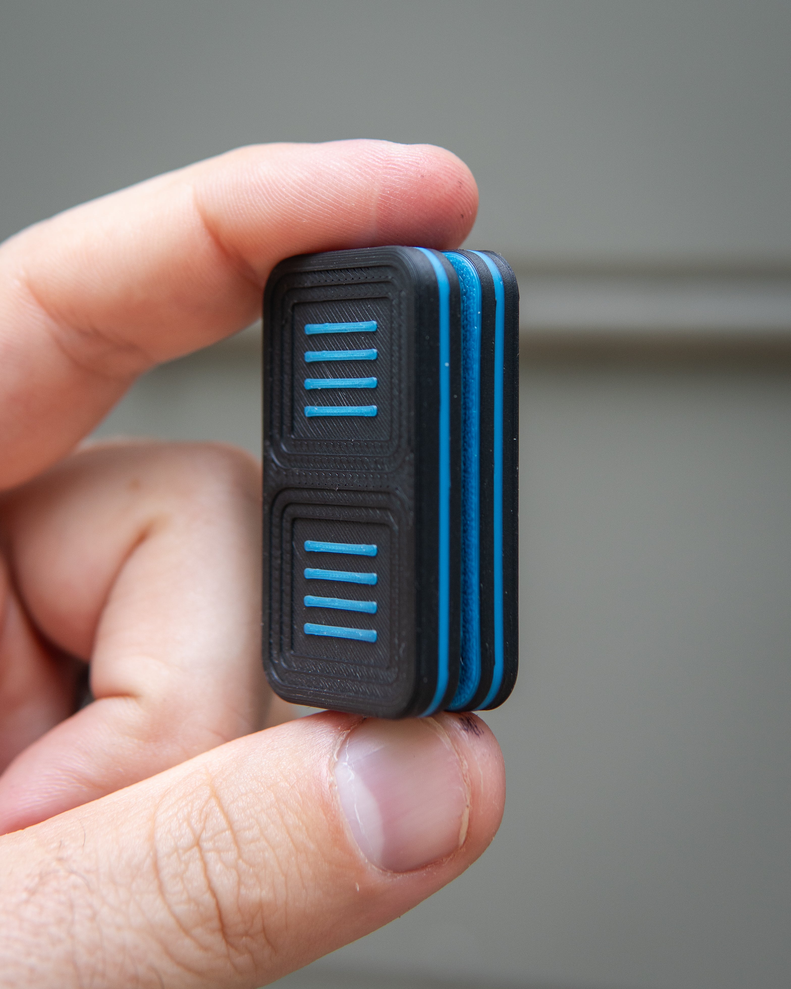 Delta Tile Fidget Slider - Maker's Choice, Black & Electric Blue Plastic