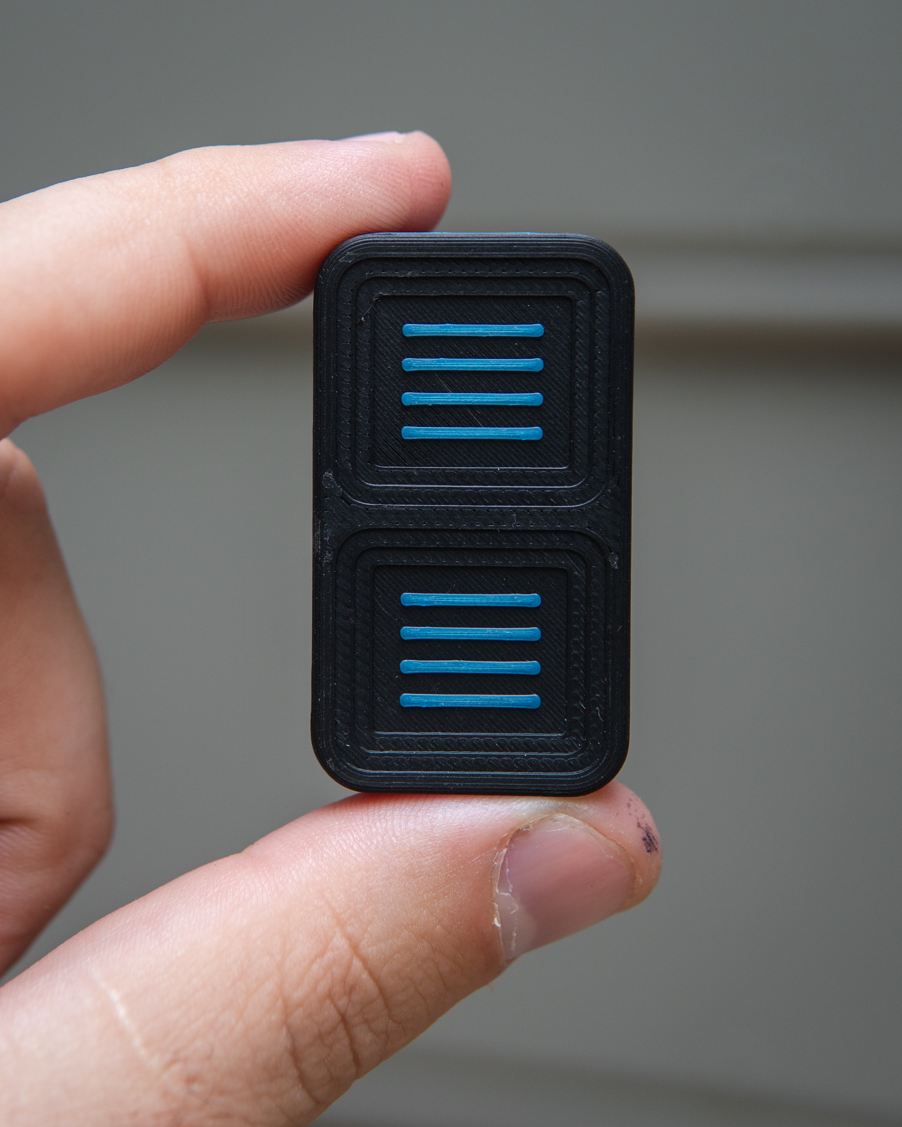 Delta Tile Fidget Slider - Maker's Choice, Black & Electric Blue Plastic